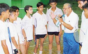 Mr S.M. Arif, former chief national badminton coach, gives tips to youngsters at the Sector 3 badminton hall in Panchkula