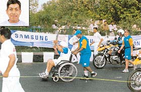 Abir Lavasa is seen escorting the famous mountaineer, Maj H.P.S. Ahluwalia (retd), during the Olympic torch ceremony held in Delhi on June 10. (inset: Abir Lavasa)