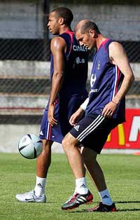 France�s Zinedine Zidane juggles with the ball alongside team-mate Thierry Henry during a training session in Santo Tirso near Porto, on Friday. France, who are drawn in Group B with England