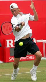 Australia�s Lleyton Hewitt returns the ball to Russia�s Igor Andreev in their quarter-final match at the Stella Artois tennis championships at The Queen�s Club, London