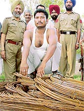 Harinder Prasad, from whom iron bars purchased through a fake bank draft were recovered, in the custody of the Crime Branch in Chandigarh on Sunday.