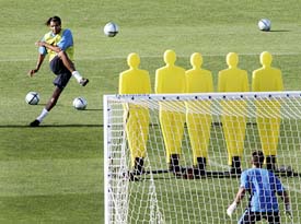 Pierre van Hooijdonk practices free kicks during closed door training of the Netherlands team on Sunday in advance of their group D match against Germany