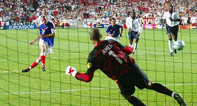 Zinedine Zidane of France scores the winning goal