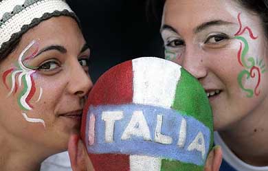 Italy supporters kiss another fan's head