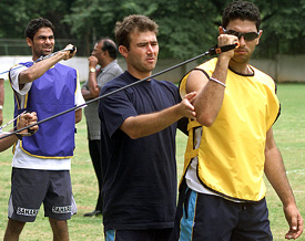Yuvraj Singh and Mohammad Kaif work with trainer Gregory Allen King