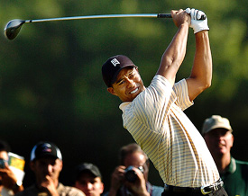 Tiger Woods tees off on the eighth hole during a practice round