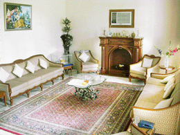 The centre table and the corner lamp have been carved in the shape of leaves and flowers out of wrought iron.