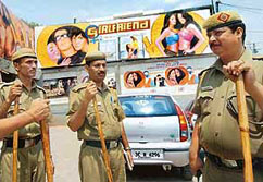 Delhi policemen assigned for the security of a cinema screening Bollywood�s latest films "Girlfriend" stand guard in front of its entrance in New Delhi on Wednesday.