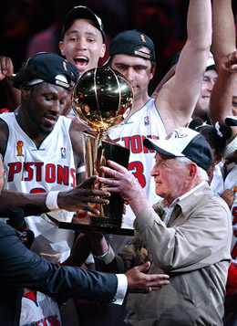Detroit Pistons owner William Davidson accepts the NBA Championship Larry O'Brien trophy