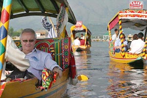 Rorger Briesch (L) Chairman of the European Union group, enjoys a shikara ride along with other members in Dal Lake in Srinagar on Thursday.