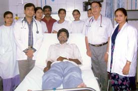 Hardev, a victim of snake bite, flanked by doctors and other staff members of DMCH, before being discharged from the hospital in Ludhiana
