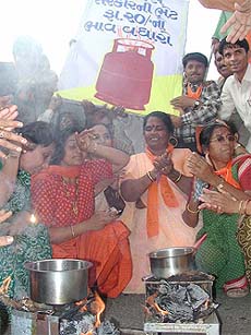 BJP women activists prepare tea using papers as fuel