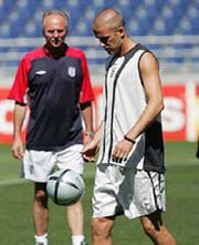 England's coach Sven Eriksson observes David Beckham during a training session