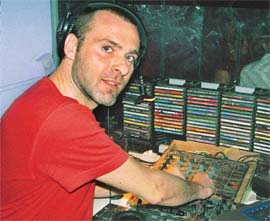 French musician and deejay, Romuald Tual, mixes music at a discotheque in Chandigarh on Friday.
