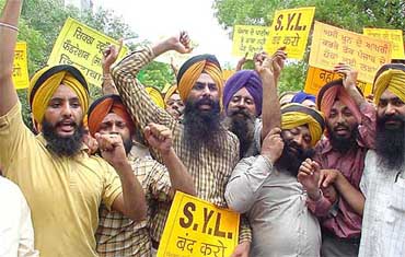 Activists of the Sikh Students Federation Punjab protest against the diversion of Punjab waters and demand stoppage of construction work on the Sutlej-Yamuna Link Canal at Parliament Street in New Delhi on Saturday