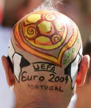 A German supporter with his head painted before the Group D match between Latvia and Germany 