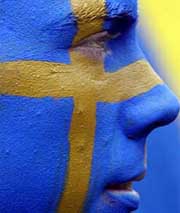 A supporter of Sweden watches the Group C match between Italy and Sweden