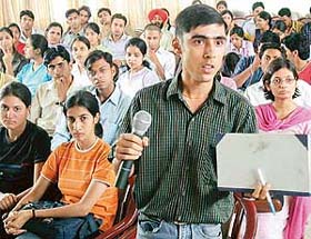 A participant asks a question at a workshop on "The science of success" held at DAV College, Sector 10, Chandigarh