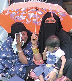 Muslim women at a demonstration against President George Bush and the US-led coalition forces