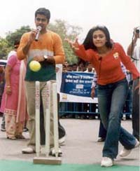 Film actress Mandira Bedi bowls to a participant during the �Gully Cricket� show organised by the Set Max channel 