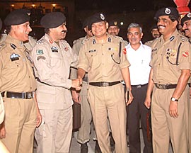 Brig Sakhi Majram (second from left), leader of the Pakistan Rangers delegation, bids farewell to the Indian delegation after the day-long meeting held across the border in Pakistan on Saturday night at the Wagah joint checkpost