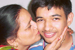 Rahul Sharma, who has topped Patiala in the Class XII (arts) examination of the Punjab School Education Board, being greeted by his mother, Meena Sharma