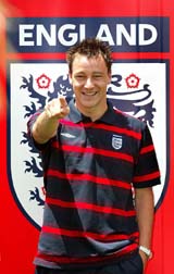 England's John Terry points during a photo session at the National Stadium in Lisbon