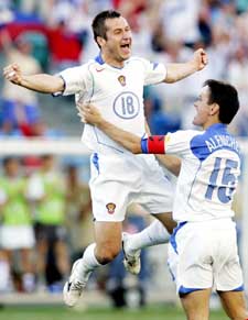 Russia's Dmitry Kirichenko  is congratulated by team-mate Dmitry Alenichev after scoring against Greece during their Euro group A match
