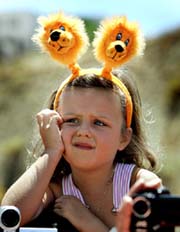 This little girl doesn't seem so happy with the results of the players at the training session of the Netherlands soccer team