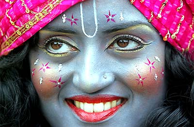 A girl dressed as Lord Krishna takes part in the Hare Krishna Rath Yatra Chariot Carnival in London on Sunday