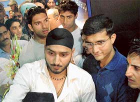 Harbhajan Singh flanked by Saurav Ganguly, Ashish Nehra and Yuvraj Singh at the inauguration of a hair-dressing salon in Chandigarh