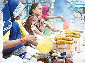 Roadside vendors roasting corn at Phase-I, Mohali