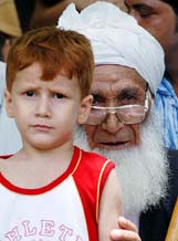 An elderly Afghan refugee with a child