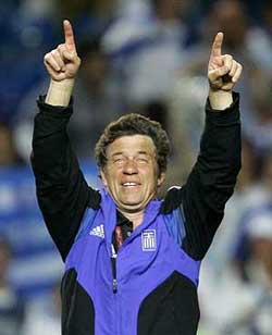 Greece's coach Otto Rehhagel from Germany celebrates after Greece qualified for the second round