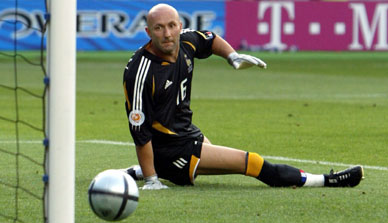 France's goalkeeper Fabien Barthez watches as a shot from Switzerland's Johann Vonlanthen rolls into the goal during their group B match in Coimbra