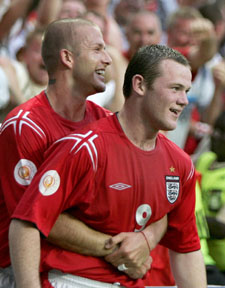 England's Wayne Rooney is congratulated by David Beckham after scoring against Croatia during their group B match