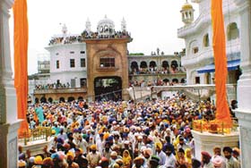Devotees throng the Golden Temple for the 400th anniversary celebrations of the installation of Guru Granth Sahib in Amritsar