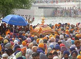 The palki procession arrives at Golden Temple complex from Gurdwara Ramsar Sahib on the occasion of the 400th anniversary celebrations of the installation of Guru Granth Sahib on Wednesday.