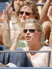 Belgian tennis player Kim Clijsters cheers for her boyfriend Lleyton Hewitt of Australia