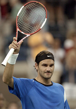 Roger Federer of Switzerland celebrates his win over Marcos Baghdalis of Cyprus at the 2004 U.S. Open