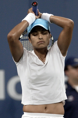 Shikha Uberoi of the USA reacts to a missed point against Venus Williams during the US Open