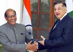Pakistan’s Foreign Secretary Riaz Khokhar and his Indian counterpart Shyam Saran gesture prior to the Secretary-level talks in New Delhi on Saturday.