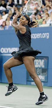 Serena Williams hits a return to Tatiana Golovin of France at the US Open