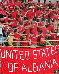 Albanian football fans celebrate after their side defeated Greece in a World Cup qualifying match