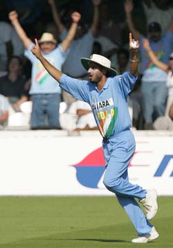 Harbhajan Singh celebrates after taking the catch of Vikram Solanki off Nehra 