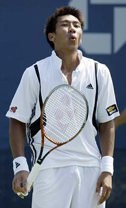 Paradorn Srichaphan of Thailand reacts to a missed point against Dominik Hrbaty of Slovakia during the US Open