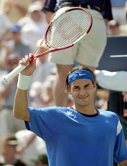 Roger Federer of Switzerland celebrates his victory over Fabrice Santoro of France at the US Open 