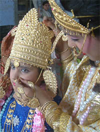 Final touches being given to a person dressed as Lord Krishna on the occasion of Janmashtmi  celebrations in Amritsar on Monday.