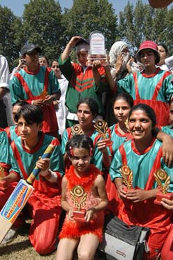 Kothibagh Higher Secondary School team poses for a photograph after winning the Women's Tennis Cricket Tournament
