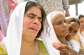 Wailing relatives of Sepoy Lakhwinder Singh at his cremation at Kheri Gujran village on Monday.